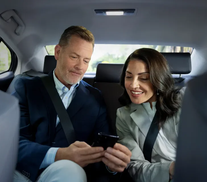 two passengers in back of Silver Service vehicle